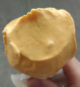 Close up of the mango ice cream to see the actual mango fibers mixed in